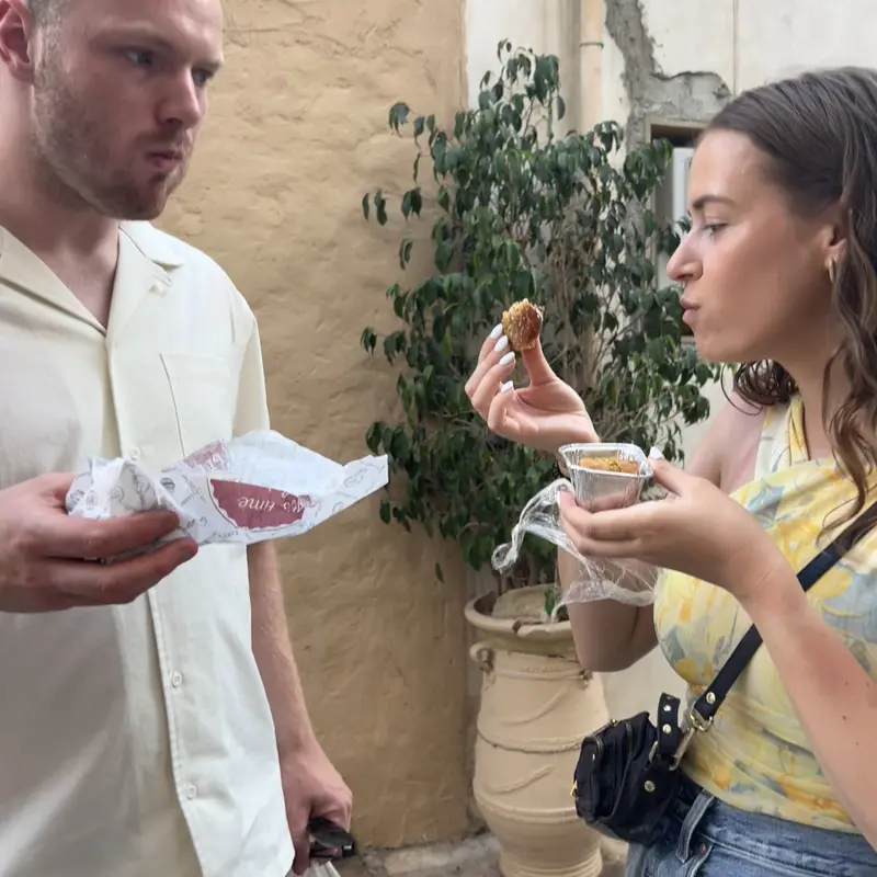 travelers eating baklava from filiko food tour