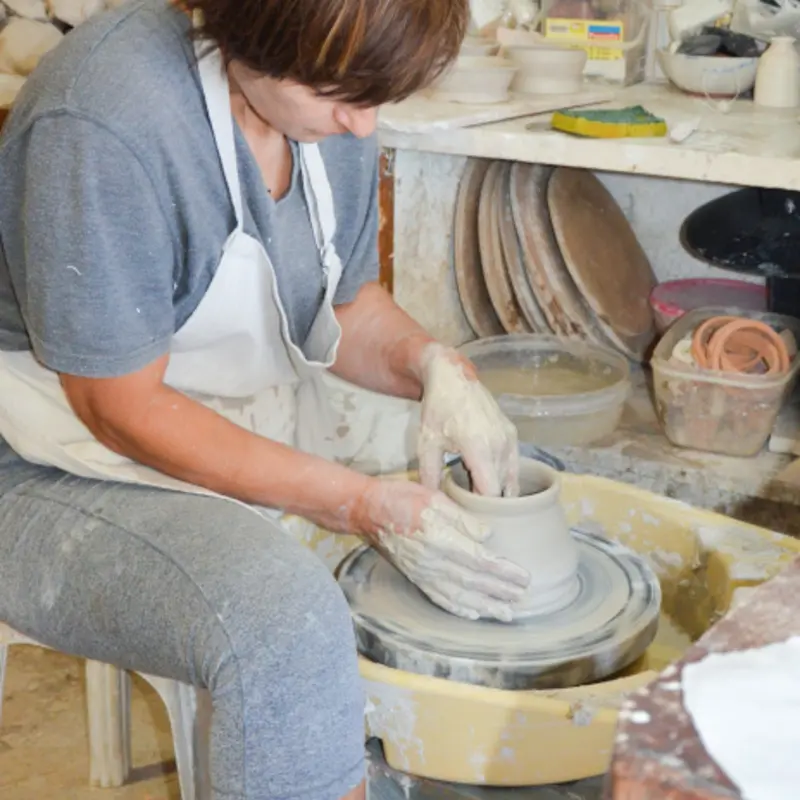 pottery artist from traditional arts and crafts tour filiko tours